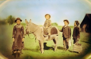 The Lost Boy (one of many) sitting on a mule.